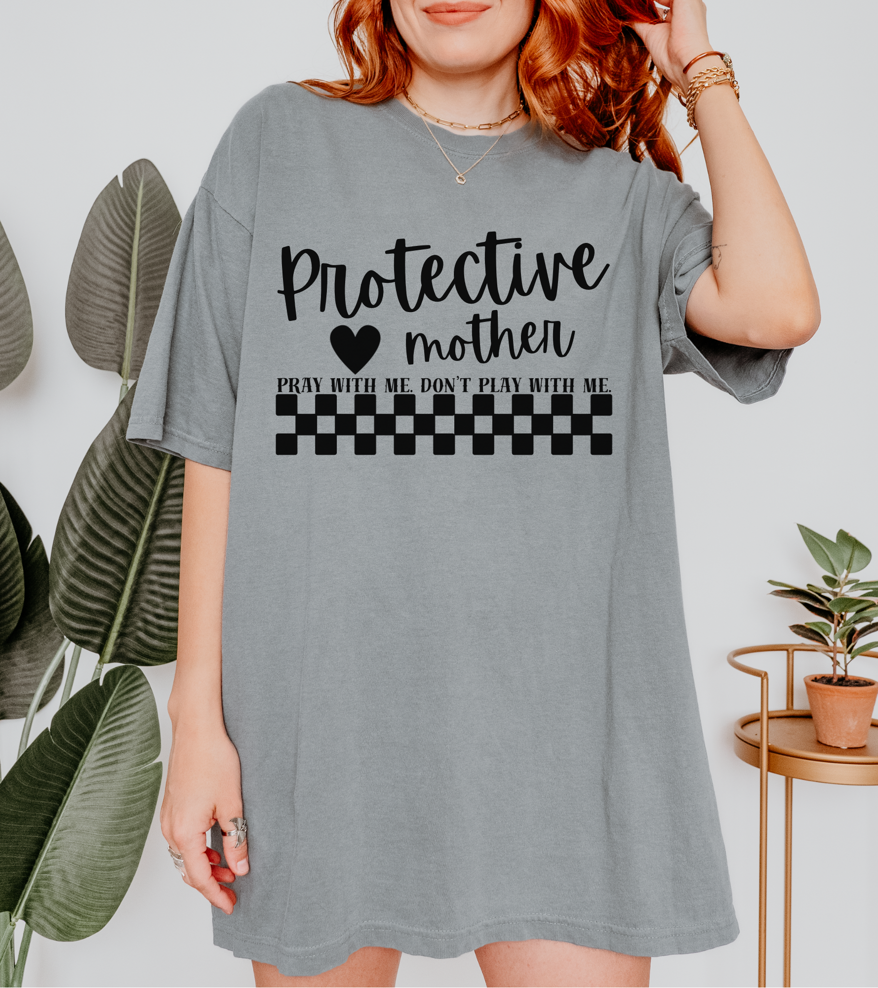 Protective Mother T-Shirt — “Protective Mother” Script Tee with Checkerboard Accent